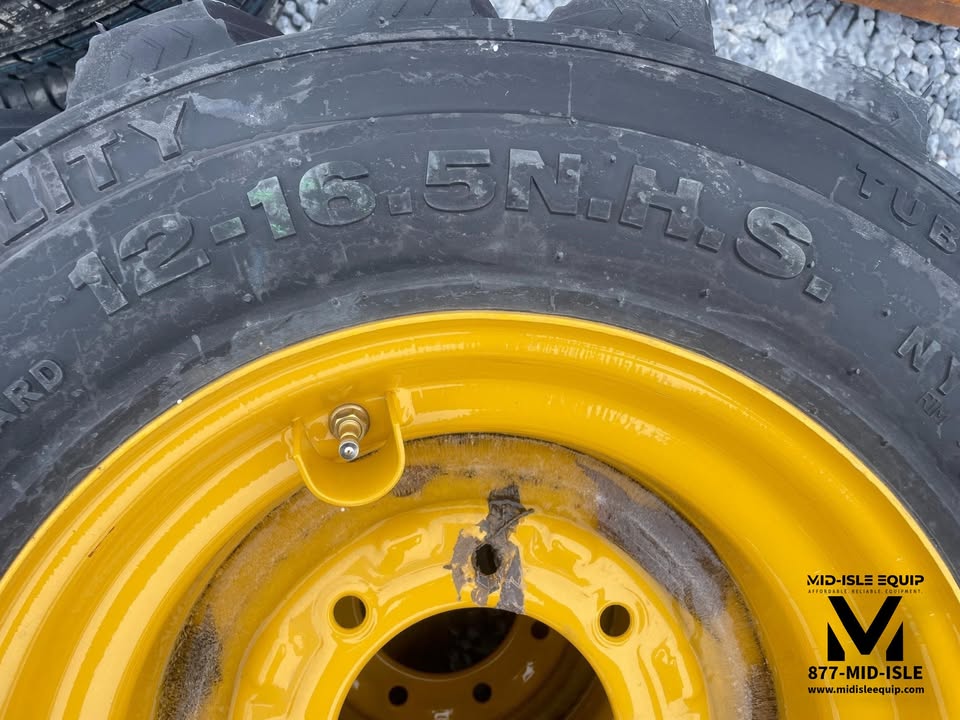 CAT SKID STEER WHEELS & TIRES 12-16.5 NEW