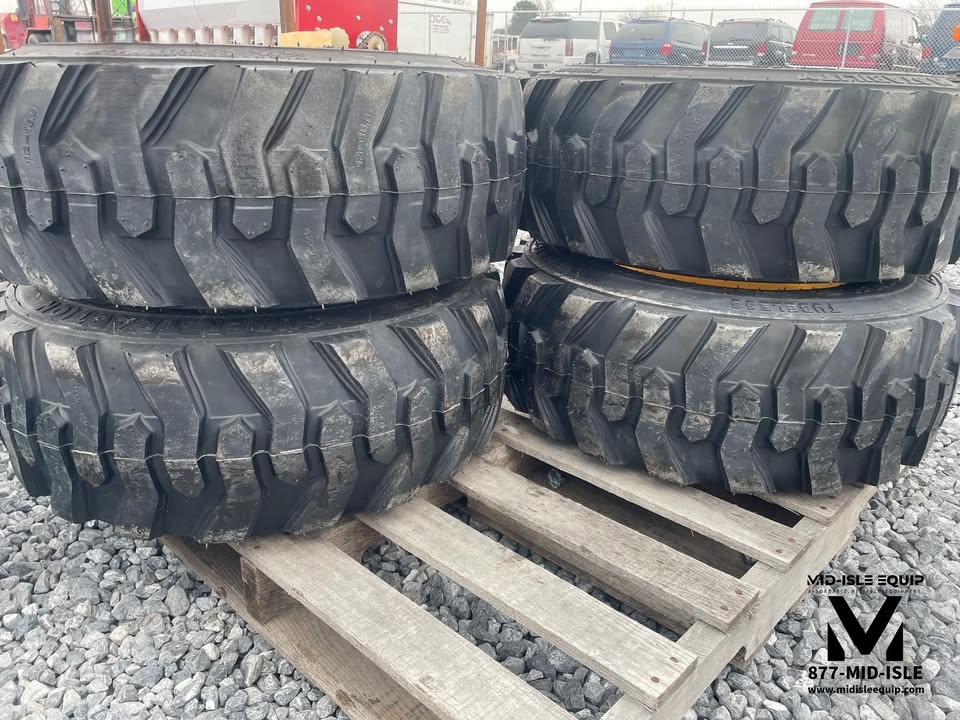 CAT SKID STEER WHEELS & TIRES 12-16.5 NEW