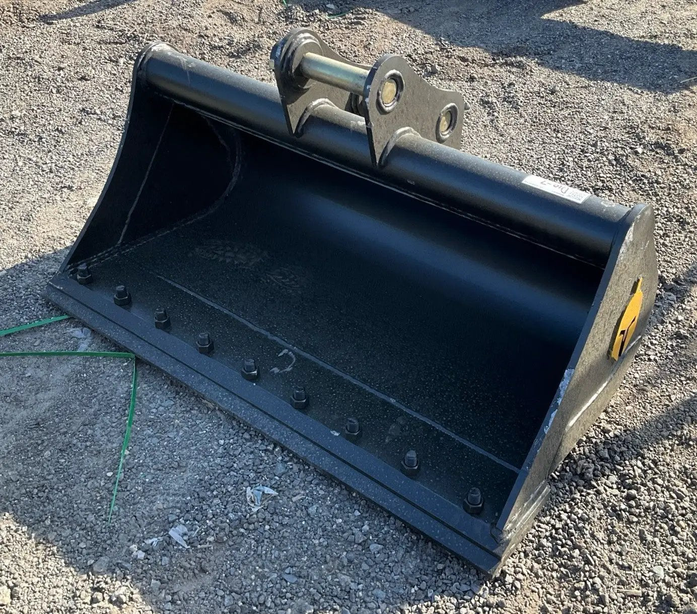 Trojan 42-inch clean-up excavator bucket in black with mounting bracket for CAT 303 and Deere 35 excavators.