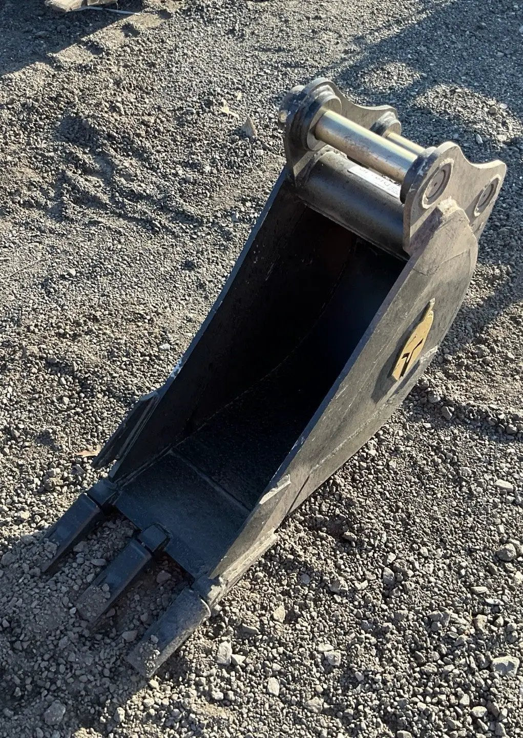 Trojan 12-inch excavator bucket attachment in black steel with Trojan logo for 5-ton CAT 305, JD50, PC55 machines