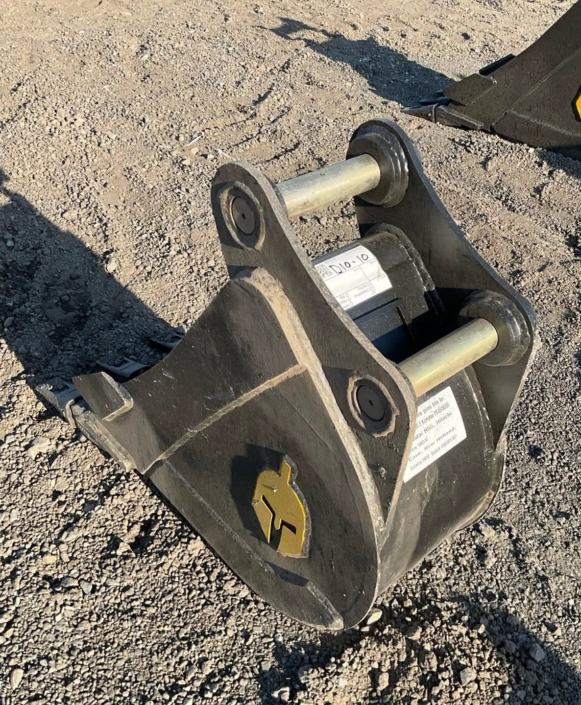 Trojan 12in excavator bucket attachment for CAT 305/JD50/PC55 5-ton machines; black steel with Trojan logo