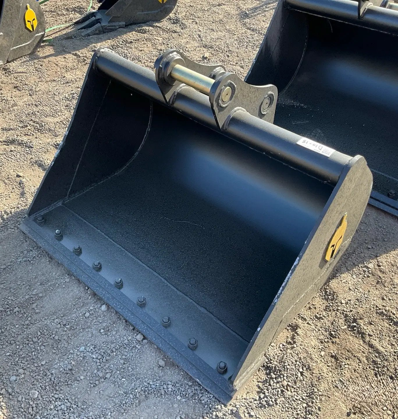 Two Trojan 42-inch clean-up buckets for CAT 305 excavator; black steel attachments.