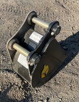 Trojan 12in excavator bucket attachment for 5-ton machines (CAT 305/JD50/PC55), black steel with mounting pins.
