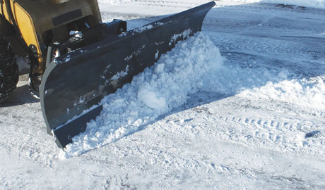 Virnig V50 hydraulic angle snow blade on a skid steer, clears snow to the side