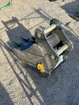 Excavator trenching bucket 12-inch Trojan attachment for Cat 303-304; black steel with yellow logo