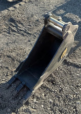Trojan 12-inch excavator bucket attachment in black steel with Trojan logo for 5-ton CAT 305, JD50, PC55 machines