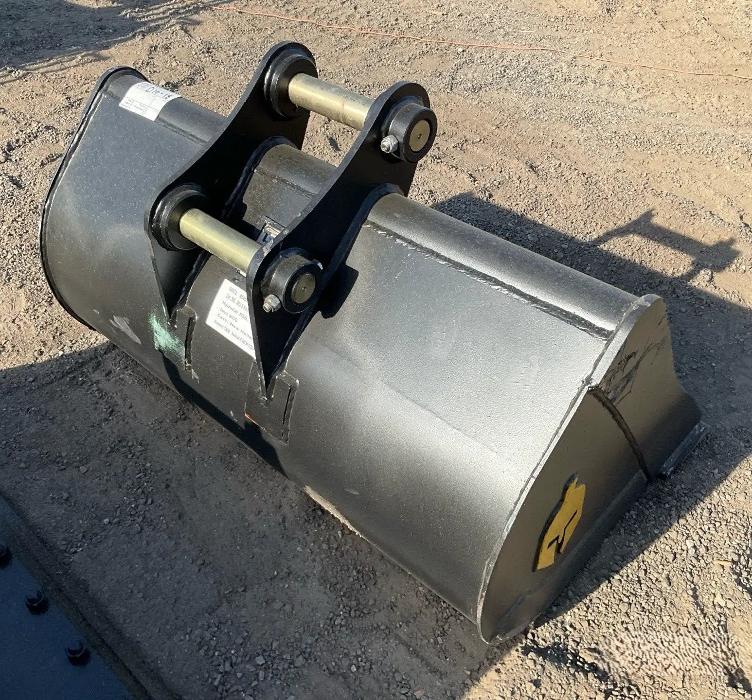 Trojan 42-inch clean-up bucket for CAT 305 excavator, steel gray with mounting pins and link assembly