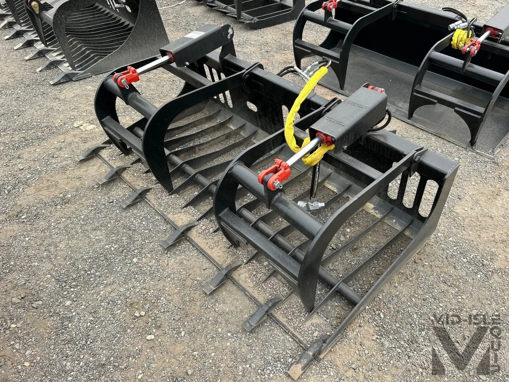 Pair of All-Star 72-inch skid steer grapple buckets with teeth in black steel by Mid-Isle Equipment